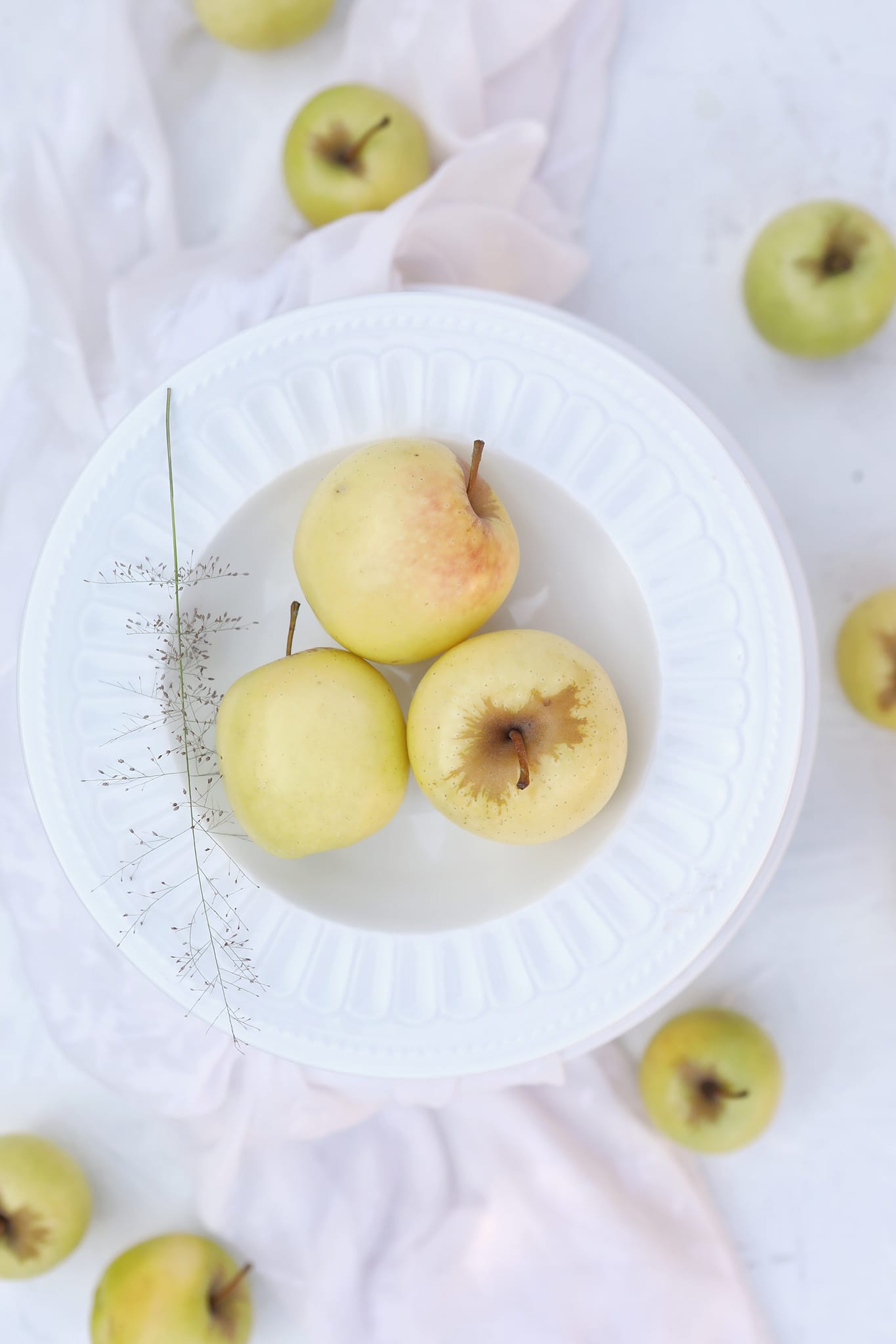 Golden apples inside a plate